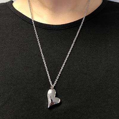 Grandma Forever in My Heart cremation necklace worn on a black shirt