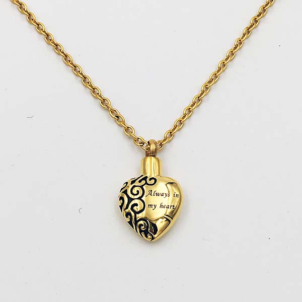 Gold heart cremation necklace for ashes engraved Always in my heart with a black swirl design